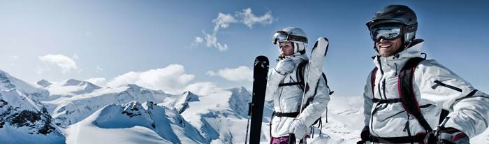 Two skiers on a mountain top
